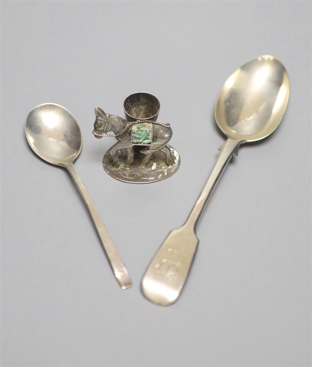 A novelty 900 white metal donkey match holder, a Victorian silver fiddle pattern dessert spoon and another silver spoon,